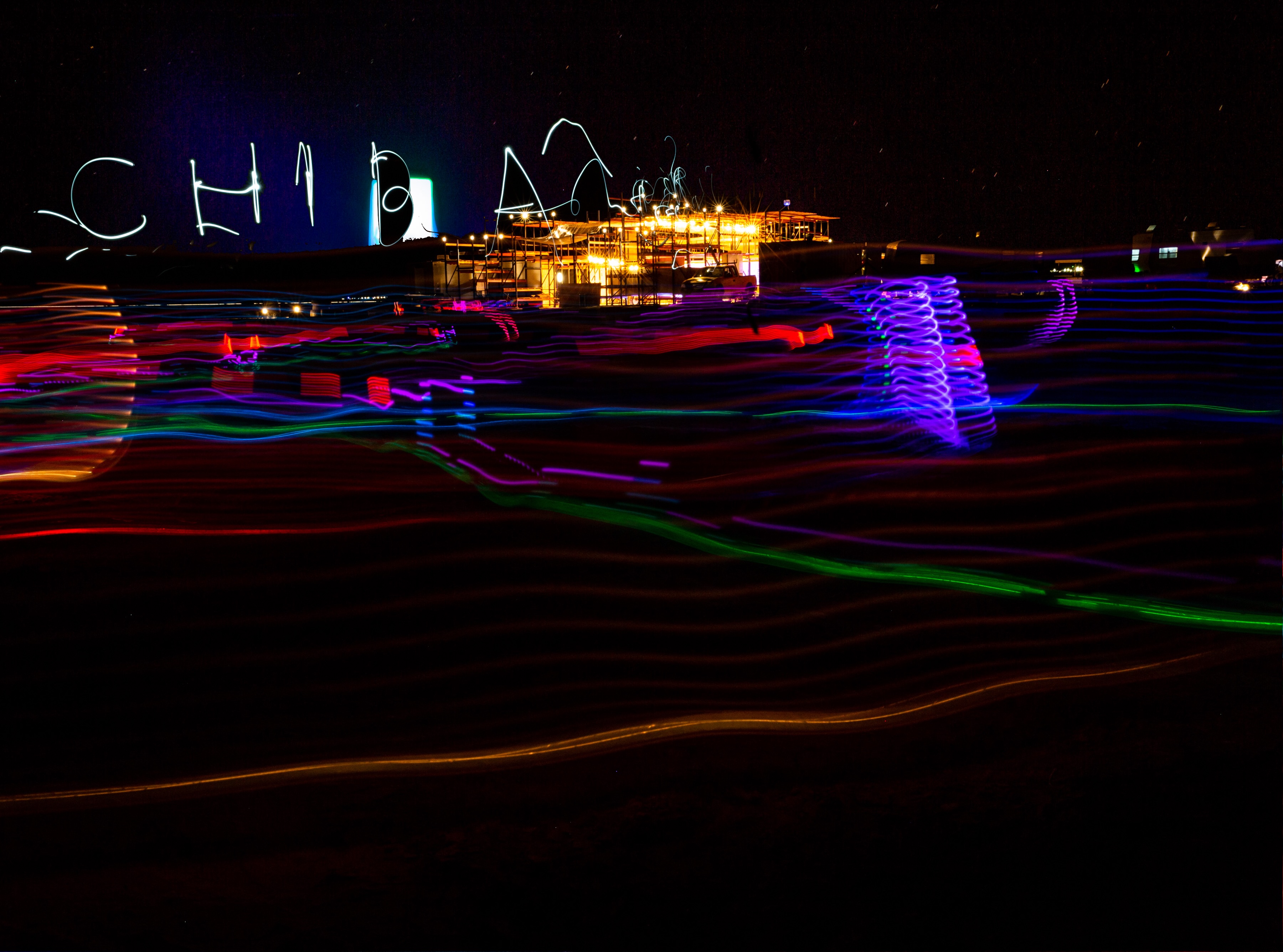 Long exposure shot of the Mars College campus at night with light trails.